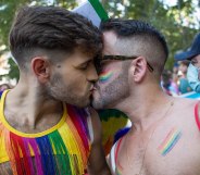 A gay or queer couple kissing