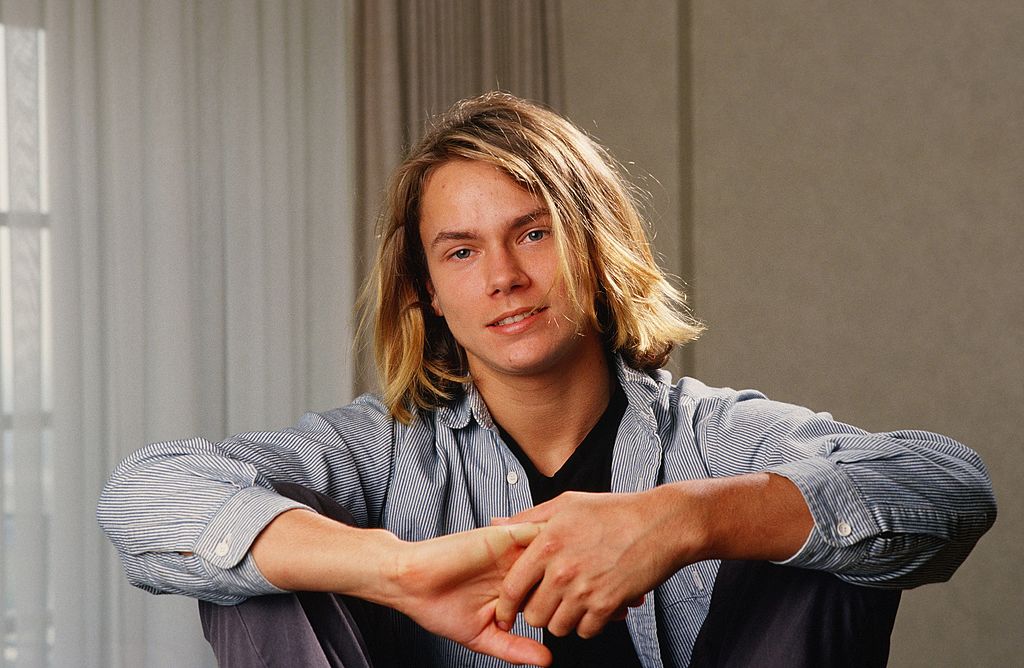 Actor River Phoenix (1970 - 1993), star of "Stand By Me," playfully poses during a 1988 Los Angeles, California, photo portrait session. Phoenix, a rising young film star, tragically died in 1993 outside a Sunset Strip nightclub of a drug overdose.