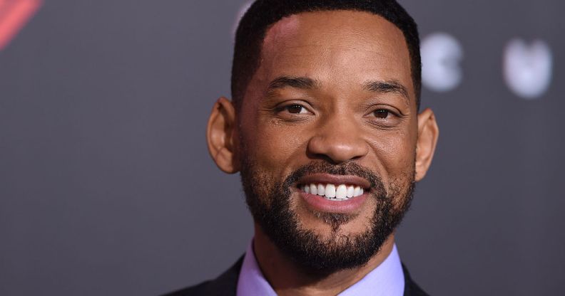 Will Smith smiling in a lilac shirt and black jacket