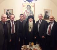 Bishop Amvrosios of Kalavryta (C) poses with followers.