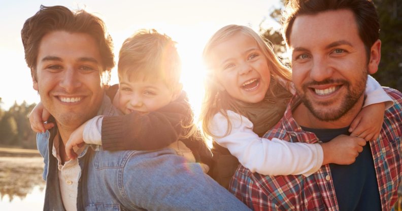 A gay male couple representing same-sex couples who have a child through an adoption agency