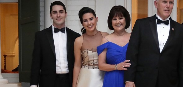 Vice President Mike Pence (C), his wife Karen Pence, their daughters Audrey (2nd L) and Charlotte (2nd R) and their son Michael and his wife Sarah pose for photographs on the front porch of the vice presidential residence at the U.S Naval Observatory before heading to the inaugural balls January 20, 2017 in Washington, DC.