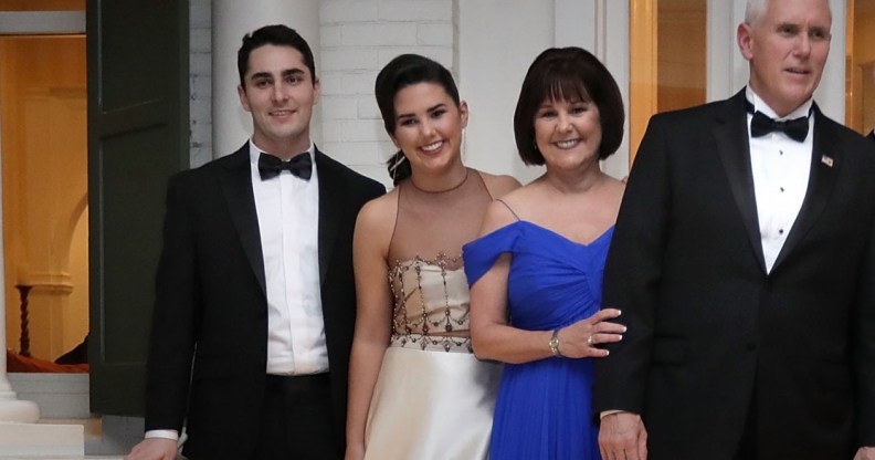 Vice President Mike Pence (C), his wife Karen Pence, their daughters Audrey (2nd L) and Charlotte (2nd R) and their son Michael and his wife Sarah pose for photographs on the front porch of the vice presidential residence at the U.S Naval Observatory before heading to the inaugural balls January 20, 2017 in Washington, DC.