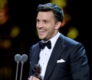 Jonny Bailey, winner of the Best Actor In A Supporting Role In A Musical award for 'Company', on stage during The Olivier Awards 2019 with Mastercard at the Royal Albert Hall on April 07, 2019 in London, England.