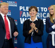 Iowa Governor Kim Reynolds (C) pictured between President Donald Trump (L) and his daughter Ivanka Trump (R), as he holds a roundtable discussion on workforce development at Northeast Iowa Community College in Peosta, Iowa, July 26, 2018.