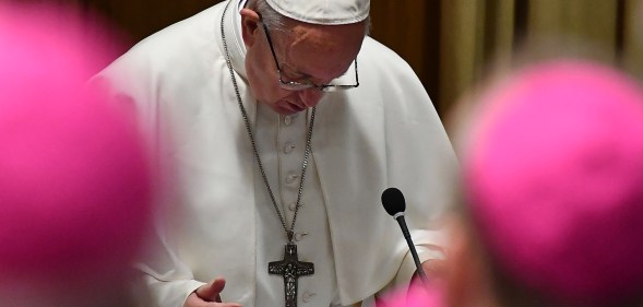 Pope Francis prays during the opening of summit on clerical sex abuse.