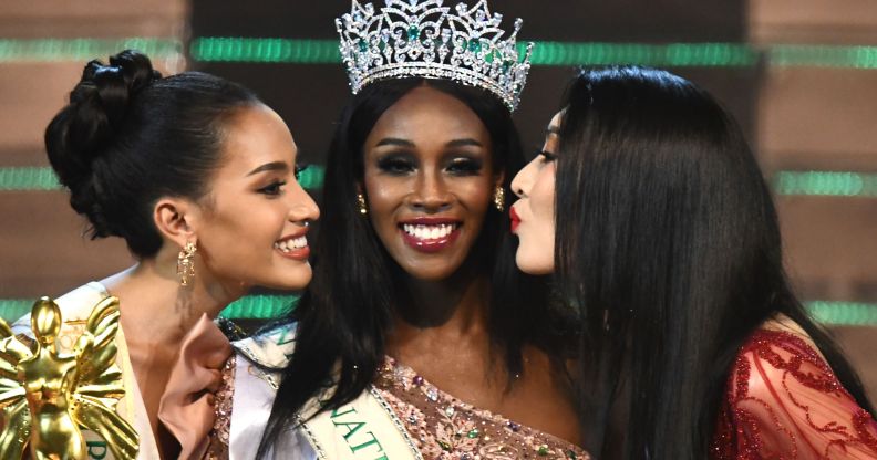 Jazell Barbie Royale (C) of the US, the Miss International Queen 2019 receives a kiss from finalists Kanwara Kaewjin (L) of Thailand and Yaya (R) of China