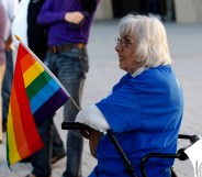 Older LGBT people like this woman holding a gay pride flag at a same-sex marriage victory celebration remain to be met.