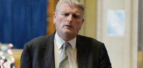 Jim Wells MLA walks through the Great Hall at Stormont