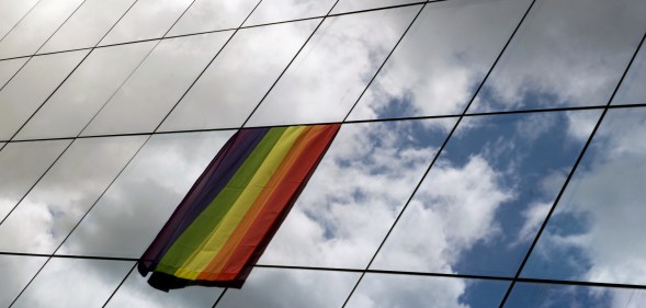 A rainbow flag is displayed on the building of European Council Office.