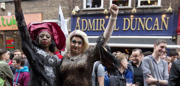 Photo of people gathering outside the Admiral Duncan pub in Old Compton Street in the Soho, which was attacked with a nail bomb on April 30, 1999, to remember the victims of the Orlando massacre, on June 13, 2016.