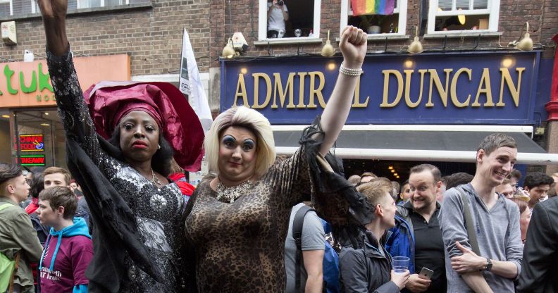 Photo of people gathering outside the Admiral Duncan pub in Old Compton Street in the Soho, which was attacked with a nail bomb on April 30, 1999, to remember the victims of the Orlando massacre, on June 13, 2016.