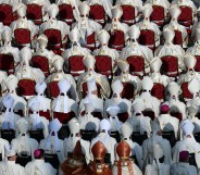 Vatican bishops and cardinals who, according to a new book, are for the most part gay, attend mass.