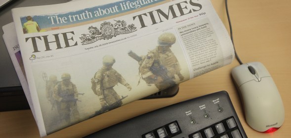 In this photo illustration a copy of The Times newspaper rests on a computer on August 7, 2009 in London.