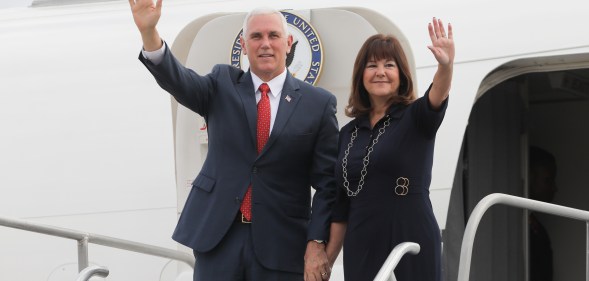 US Vice-President Mike Pence and his wife Karen Pence wave upon landing at a military air base in Brasilia June 26, 2018.