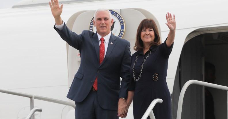 US Vice-President Mike Pence and his wife Karen Pence wave upon landing at a military air base in Brasilia June 26, 2018.