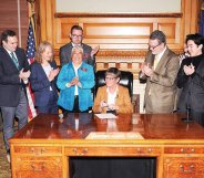 Governor of Kansas Laura Kelly signs an executive order protecting LGBT+ state employees from discrimination