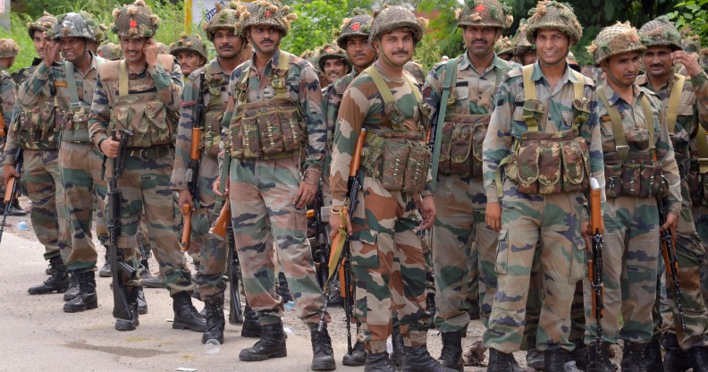 Indian Army personnel stand guard in the Gurdaspur district of Punjab state