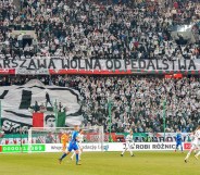 The banner displayed by Legia Warsaw fans at its Polish Army stadium