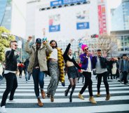 The Queer Eye cast jumping in the middle of a road