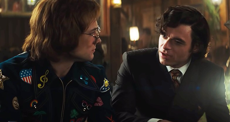 Taron Egerton and Richard Madden as Elton John and John Reid in Rocketman