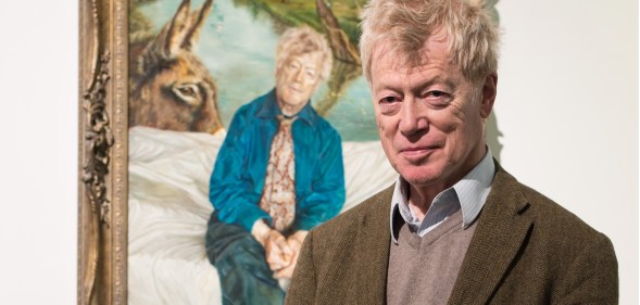 Tory housing tsar Sir Roger Scruton poses next to his portrai