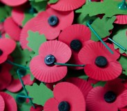 A pile of the iconic red emblem of the British Legion's annual poppy appeal sits on a work bench at the company headquarters in Richmond, London on November 7, 2012 in London, England.