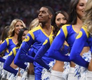 Los Angeles Rams cheerleader Quinton Peron looks on during Super Bowl LIII against the New England Patriots at Mercedes-Benz Stadium on February 3, 2019 in Atlanta, Georgia.