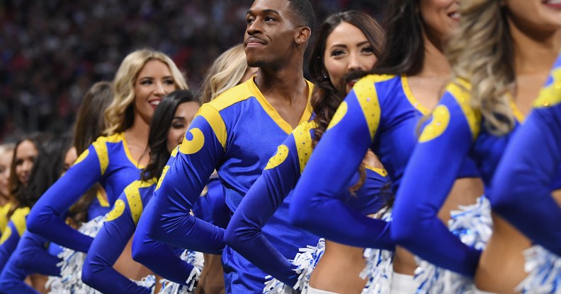 Los Angeles Rams cheerleader Quinton Peron looks on during Super Bowl LIII against the New England Patriots at Mercedes-Benz Stadium on February 3, 2019 in Atlanta, Georgia.