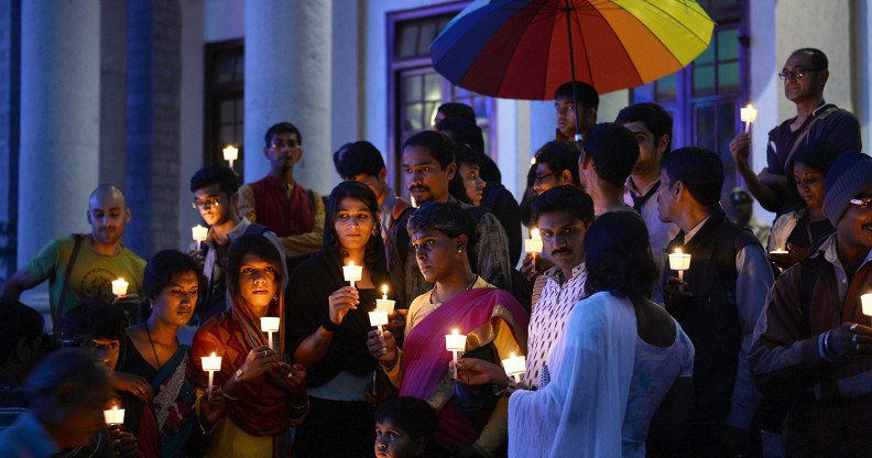 Transgender activists and their supporters take part in a candle light vigil.