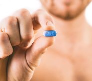 PrEP Impact trial: Man holding a pill used for Pre-Exposure Prophylaxis (PrEP) to prevent HIV infection