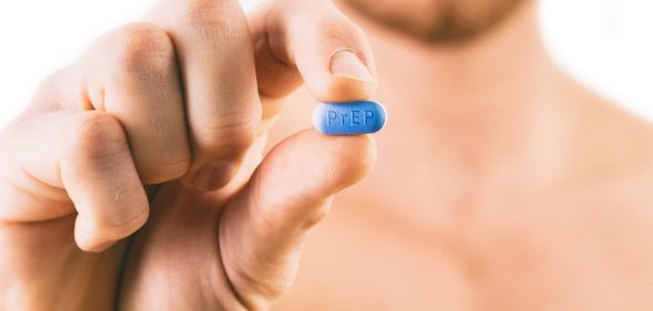 PrEP Impact trial: Man holding a pill used for Pre-Exposure Prophylaxis (PrEP) to prevent HIV infection