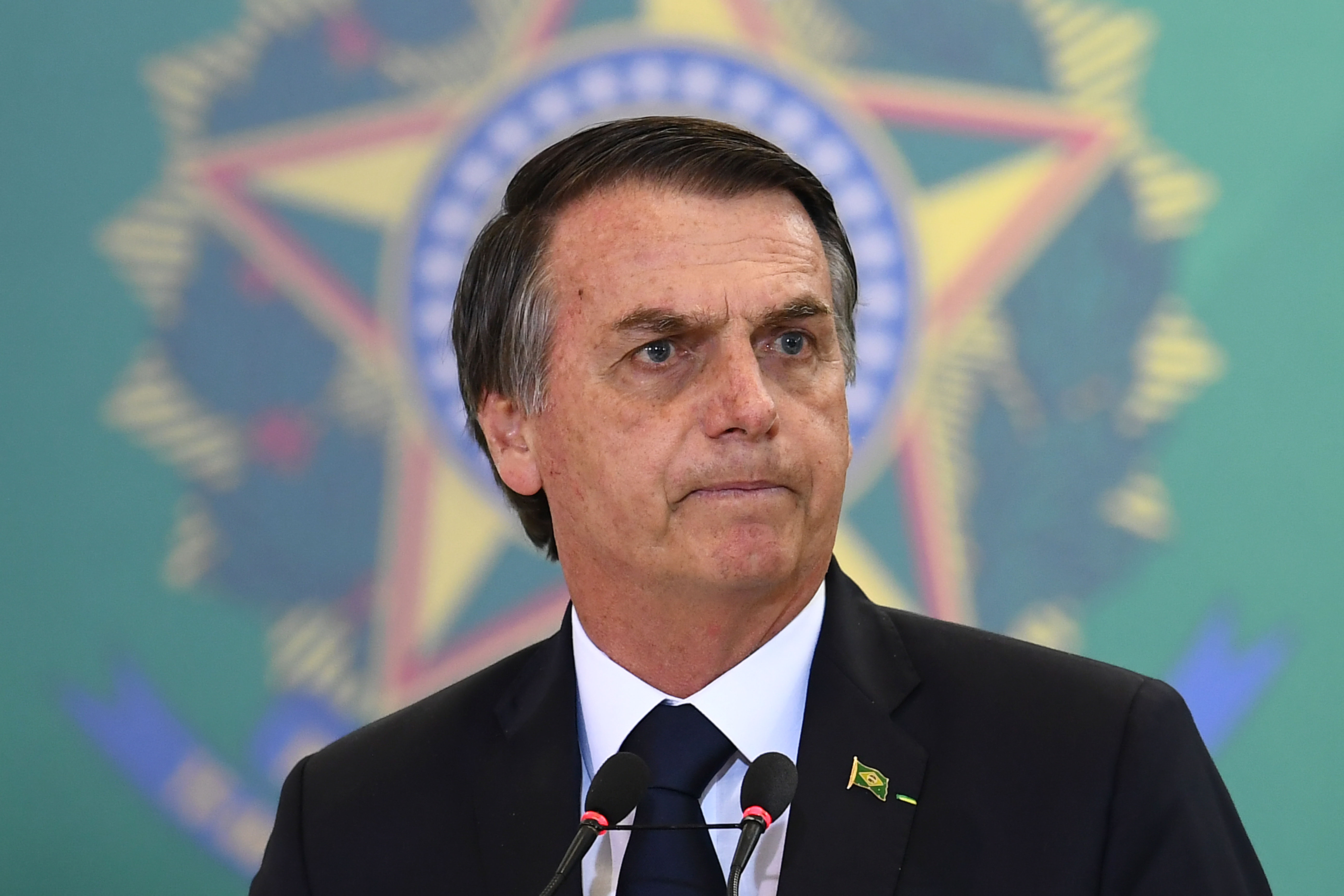 Brazilian President Jair Bolsonaro delivers a speech during the appointment ceremony of the new heads of public banks, at Planalto Palace in Brasilia on January 7, 2019