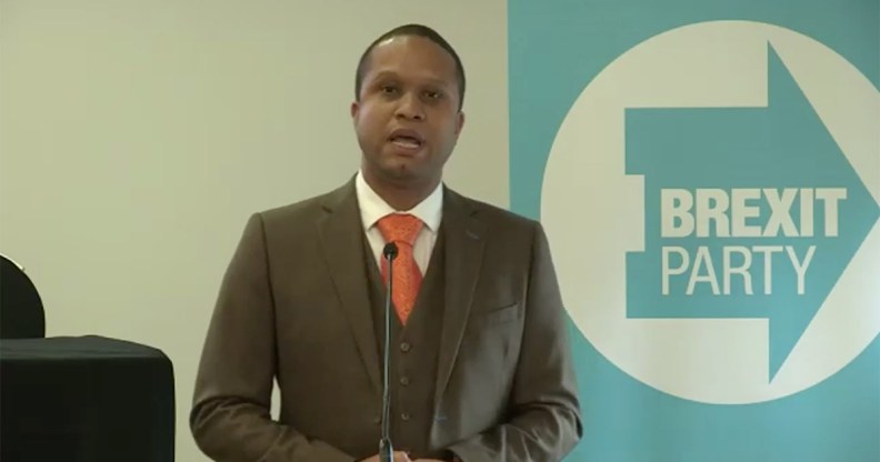 Louis Stedman-Bryce speaking into a microphone