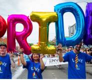 People holding Pride balloons at Edmonton Pride