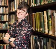 Lyra McKee posing in a library