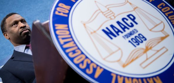 Derrick Johnson, President and CEO of the NAACP, pauses while speaking during a press conference announcing a lawsuit by the NAACP