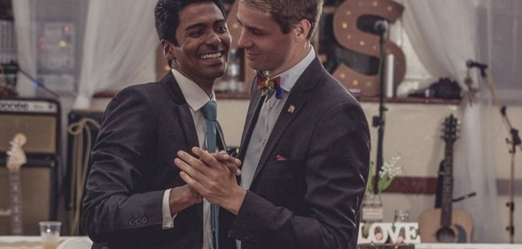 The grooms in Saint Helena's first gay wedding, Michael Wernstedt and Lemarc Thomas, dance in suits