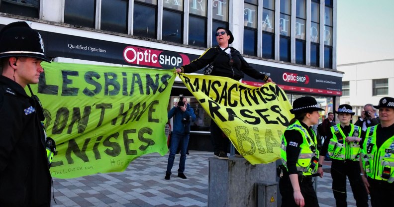 Women holding banners at Swansea Pride