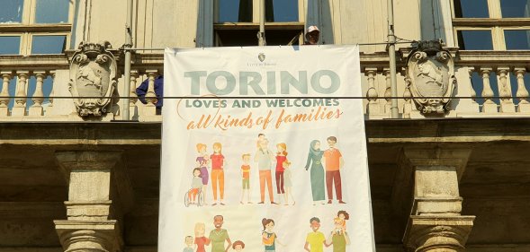 Turin mayor unveiled a banner is support of same-sex families to counter the anti-LGBT World Congress of Families in Verona.