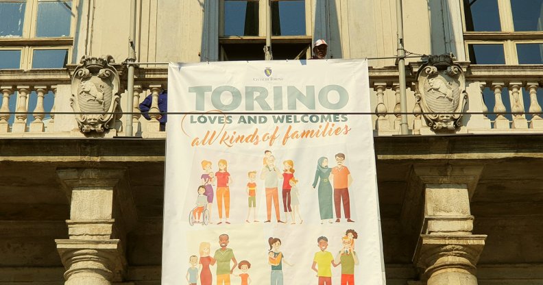 Turin mayor unveiled a banner is support of same-sex families to counter the anti-LGBT World Congress of Families in Verona.