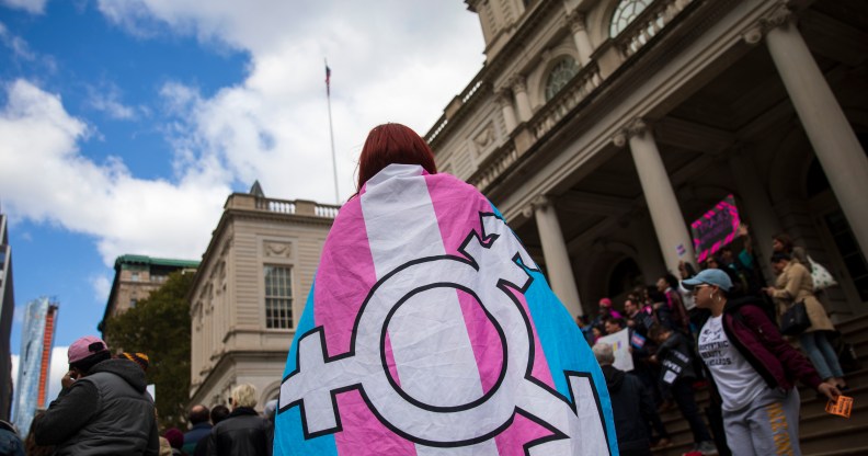 Photo of person adorned in trans flag crime england wales