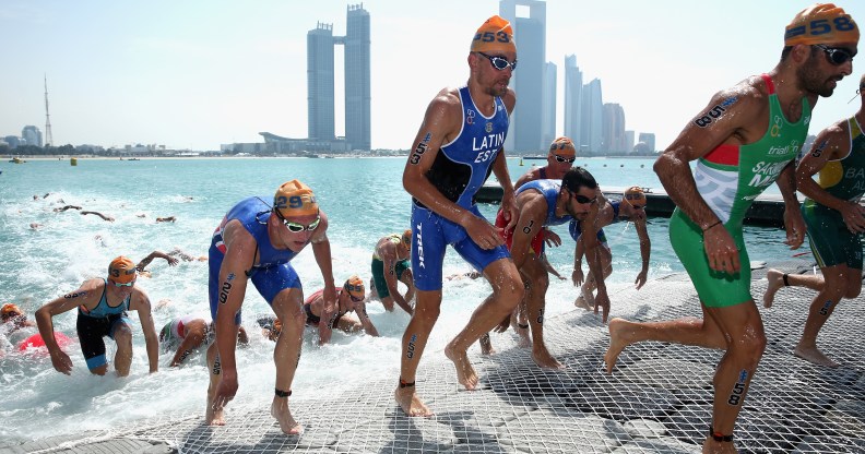 The Elite Men leave the water during the 2016 ITU World Triathlon Abu Dhabi on March 5, 2016 in Abu Dhabi, United Arab Emirates.