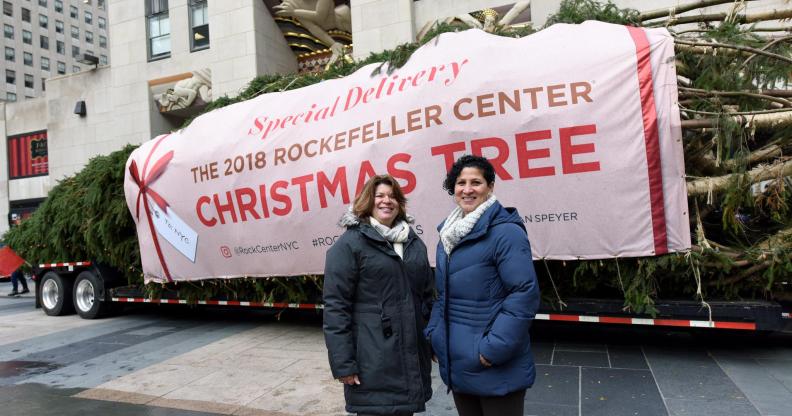 Lesbian couple Shirley Figueroa and Lissette Gutierrez pose with the Rockefeller Center tree they donated.