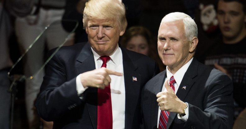 CINCINNATI, OH - DECEMBER 01: President-elect Donald Trump and Vice President-elect Mike Pence stand onstage together at U.S. Bank Arena on December 1, 2016 in Cincinnati, Ohio. Trump took time off from selecting the cabinet for his incoming administration to celebrate his victory in the general election. (Photo by Ty Wright/Getty Images)