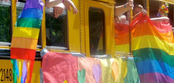 A Gay-Straight Alliance school bus takes part in a Pride parade