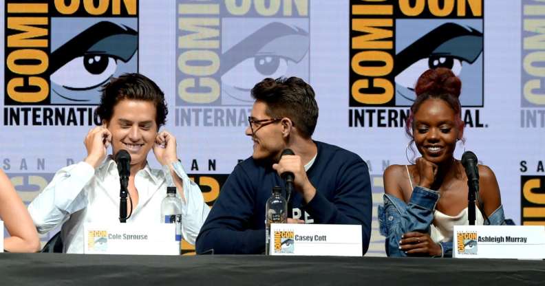 SAN DIEGO, CA - JULY 22: (L-R) Cole Sprouse, Casey Cott and Ashleigh Murray speak onstage at the "Riverdale" special video presentation and Q&A during Comic-Con International 2018 at San Diego Convention Center on July 22, 2018 in San Diego, California. (Photo by Kevin Winter/Getty Images)