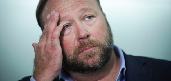 WASHINGTON, DC - SEPTEMBER 5: Alex Jones of InfoWars talks to reporters outside a Senate Intelligence Committee hearing concerning foreign influence operations' use of social media platforms, on Capitol Hill, September 5, 2018 in Washington, DC. Twitter CEO Jack Dorsey and Facebook chief operating officer Sheryl Sandberg faced questions about how foreign operatives use their platforms in attempts to influence and manipulate public opinion. (Photo by Drew Angerer/Getty Images)