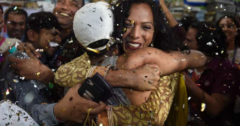 Indian members and supporters of the lesbian, gay, bisexual, transgender (LGBT) community celebrate the Supreme Court decision to strike down a colonial-era ban on gay sex, in Mumbai on September 6, 2018. - India's Supreme Court on September 6 struck down the ban that has been at the centre of years of legal battles. "The law had become a weapon for harassment for the LGBT community," Chief Justice Dipak Misra said as he announced the landmark verdict. (Photo by INDRANIL MUKHERJEE / AFP) (Photo credit should read INDRANIL MUKHERJEE/AFP/Getty Images)