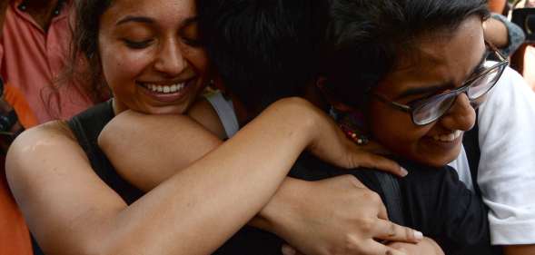 Indian members of the lesbian, gay, bisexual, transgender (LGBT) community celebrate outside the Supreme Court after the decision to strike down the colonial-era ban on gay sex in New Delhi on September 6, 2018. - India's Supreme Court on September 6 struck down the ban that has been at the centre of years of legal battles. "The law had become a weapon for harassment for the LGBT community," Chief Justice Dipak Misra said as he announced the landmark verdict. (Photo by Sajjad HUSSAIN / AFP) (Photo credit should read SAJJAD HUSSAIN/AFP/Getty Images)